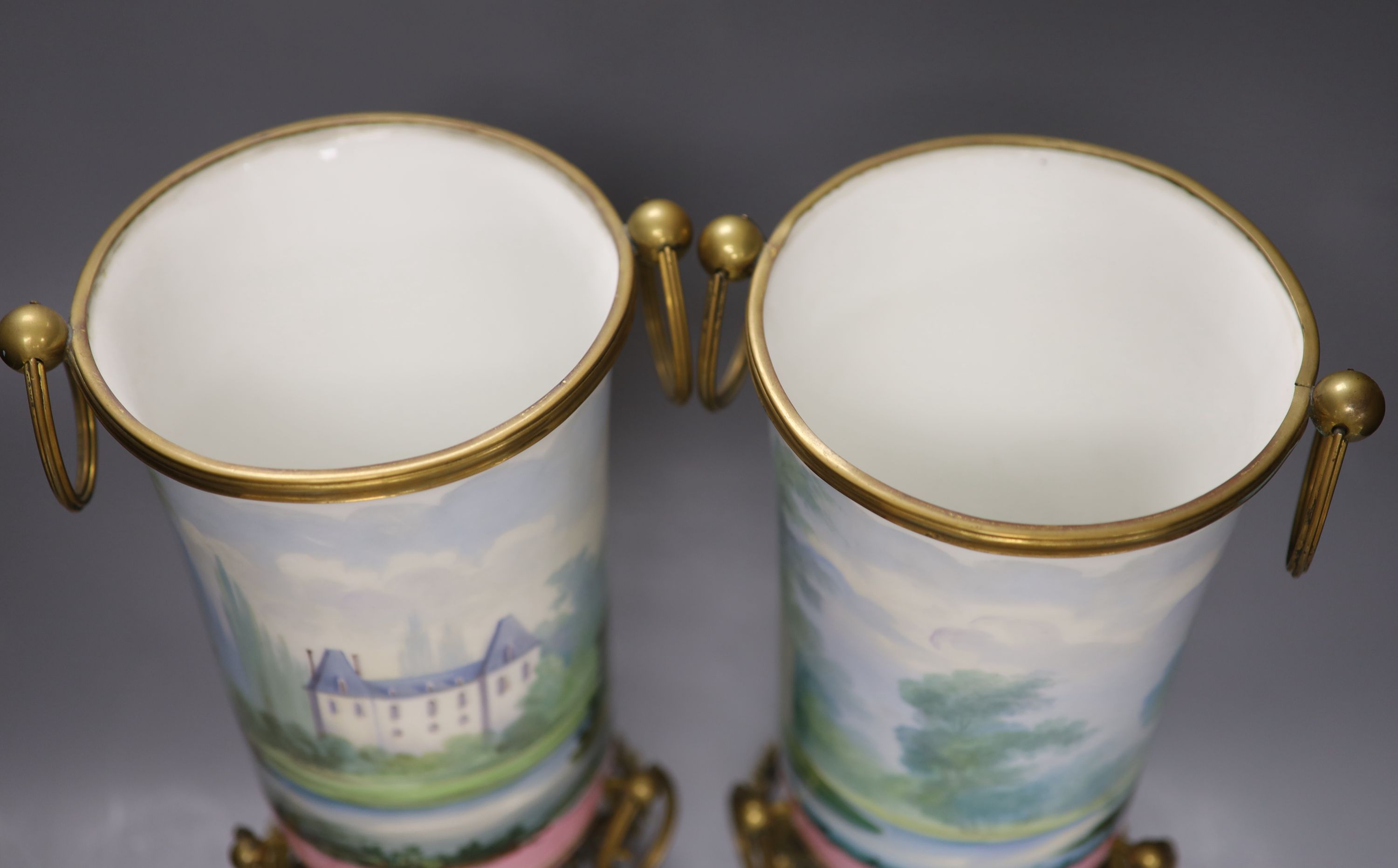 A pair of late 19th century Paris porcelain and gilt metal mounted vases, height 33cm